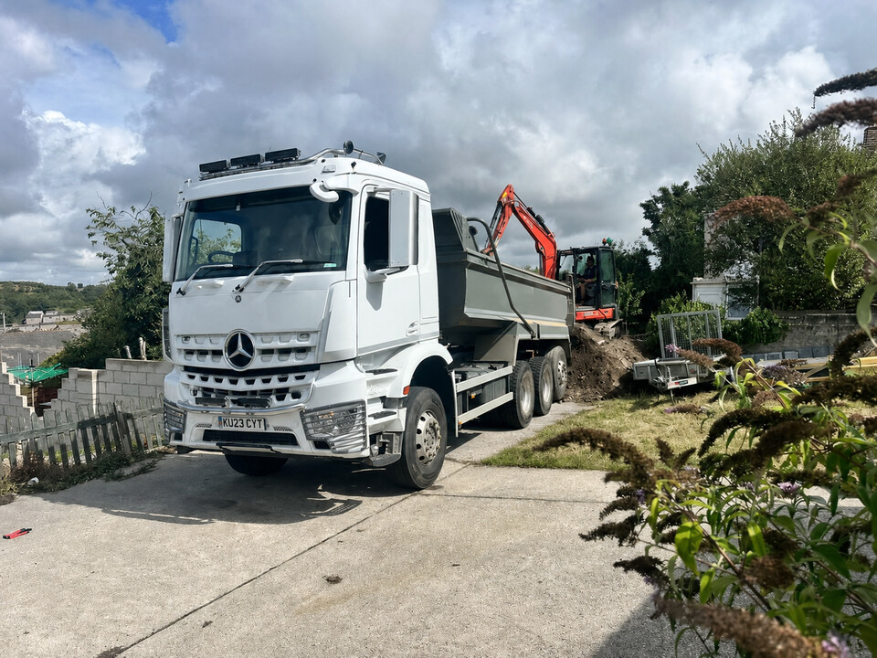 Tipper and excavator supporting a construction project in Cornwall